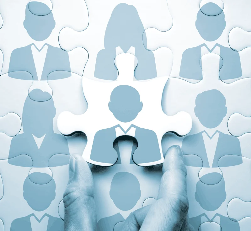 Nearly completed close up of puzzle with people icon